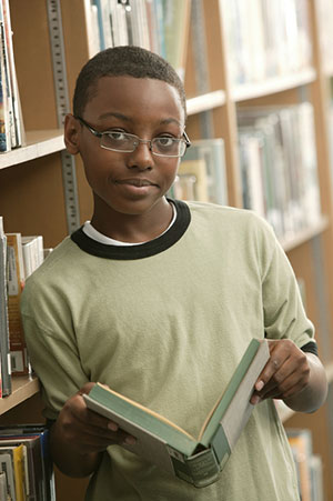 boy with glasses and book