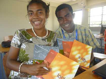 Titilia Koula & Epeli Vatu proudly showing resources donated by PETAA